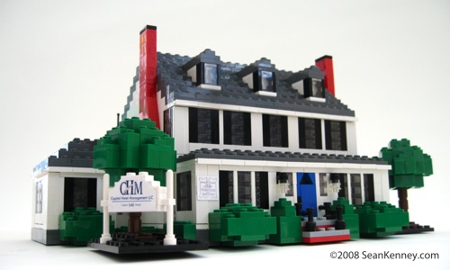 Historic house, LEGO bricks.  By Sean Kenney.  Dormers shingles front step porch windows chimney sign trees colonial