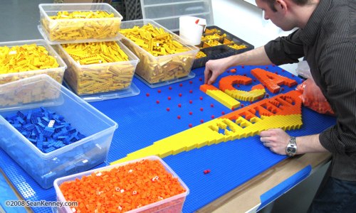 Artist Sean Kenney working on his Good Morning America logo, built with 11,500 LEGO bricks